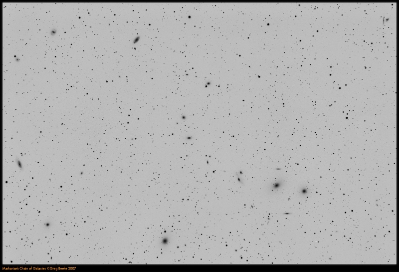 Markarian Chain Negative.jpg - Title: Markarian Chain By: Greg Beeke Negative image to show the fuzzies.A mixture of subs was used; about 20x240s and 15x120s luminance - I'm still experimenting to find the optimum sub length. L-LRGB combined, which I find works well for galaxies.Telescope: Borg 100ED f/4CCD: Trifid 2 6303 CL2